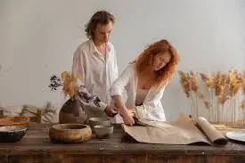 this is the image of two persons where they are making handmade products. 