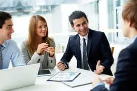 This is the image of a business consulting in a office where four persons are sitting. small business ideas is best to start in begginings.
they are providing business consulting coachings to different clients.