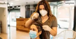 this is a image of a women who is providing beauty services to another women in his saloon. which is a small business ideas
